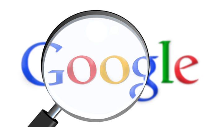 Google logo against a white environment with a black magnifying glass over the logo