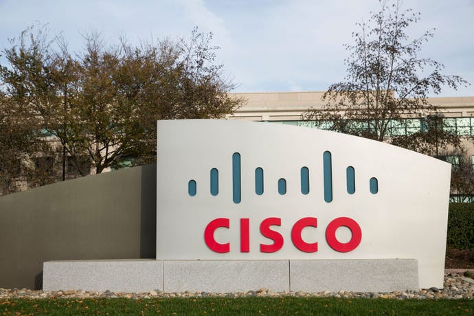 A photo of the welcome sign at a Cisco campus; the sign is the company logo on an asymmetric slab