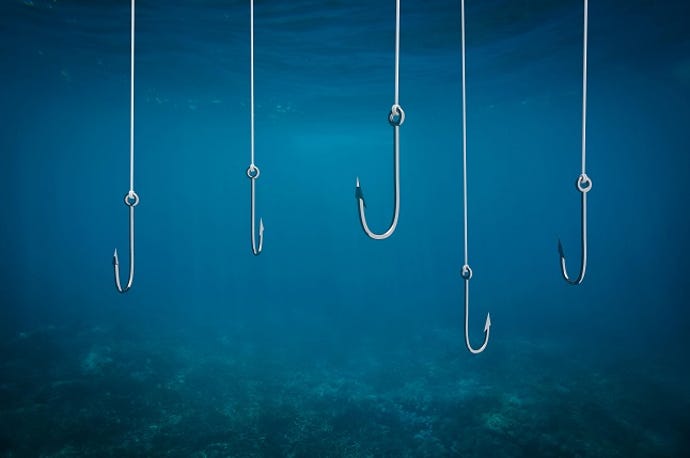 fishhooks dangling in blue water