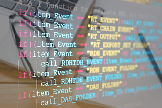 Pentesting code on a highly reflective screen that reveals reflections of a keyboard and eyeglasses