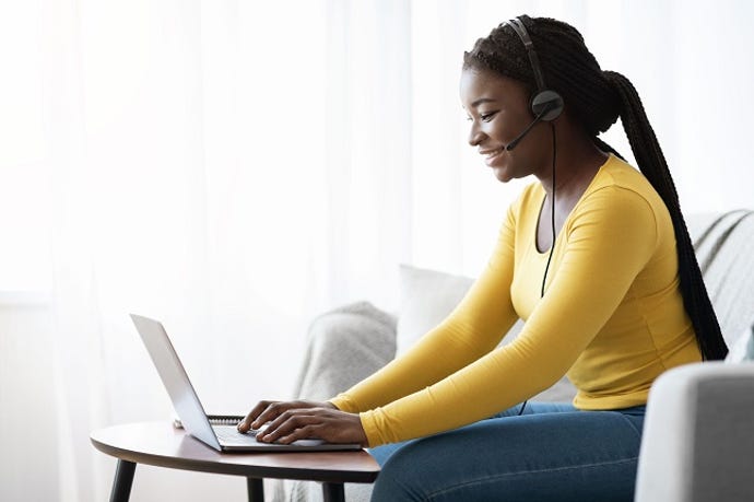 remote worker with laptop and headset