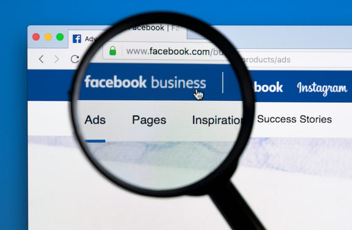 facebook website with magnifying glass over "facebook business" header