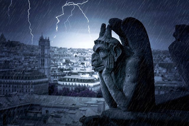 Rainy Night with thunderstorm and lightning over The Gargoyles of Notre Dame in Paris