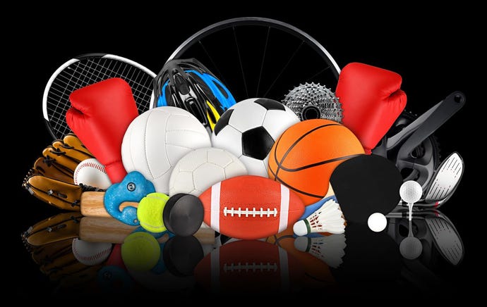 huge collection stack of sport balls gear equipment from various sports concept on dark black background