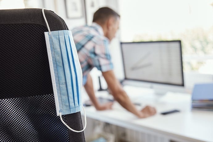 Mask on chair in office