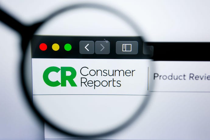 Consumer reports website viewed through a magnifying glass
