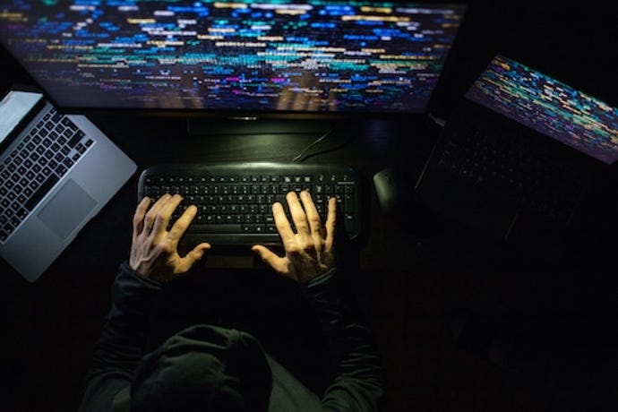 an overhead image of someone typing on a keyboard
