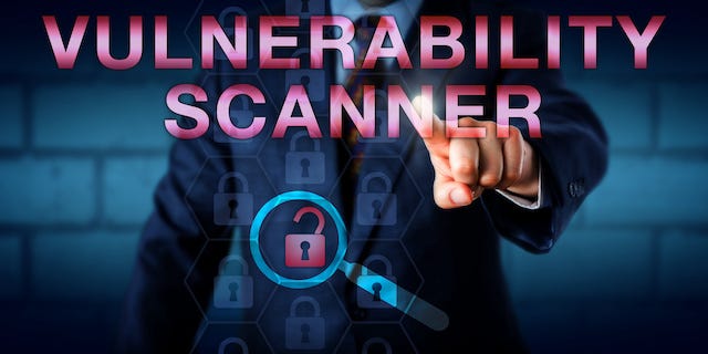 Person tapping a screen that says vulnerability scanner.