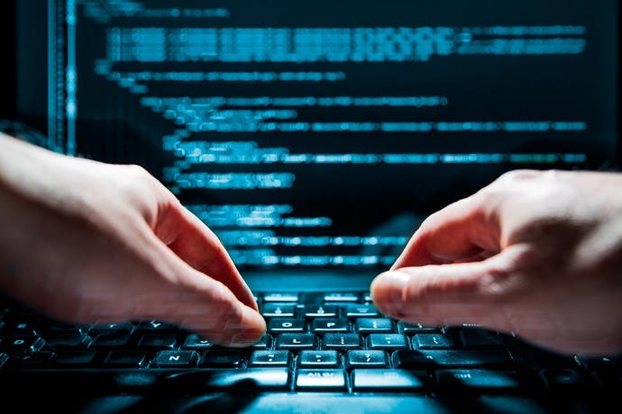 Image of hacker hands on a keyboard