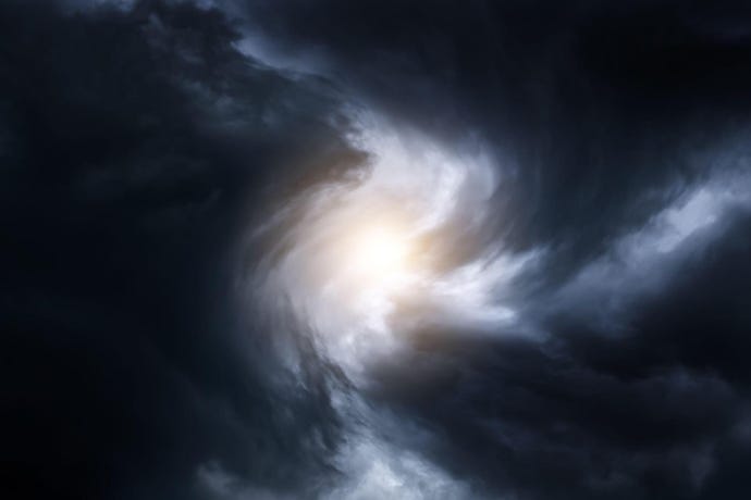 blurred whirlwind in dark storm clouds