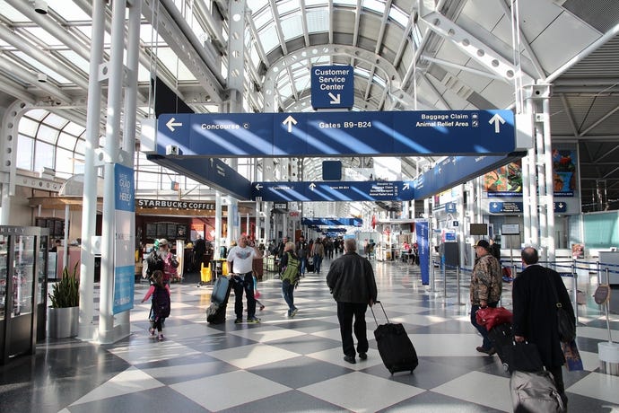 Photo of people walking through a terminal at Chicago's O'Hare airport