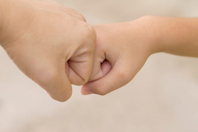 Encouraging fist bump