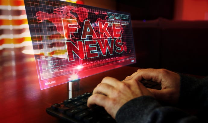 Concept image with the words fake news on computer screen