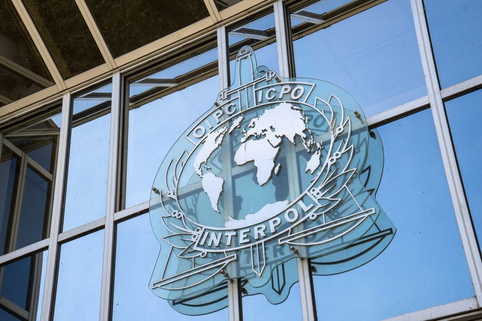 the INTERPOL logo on a building.