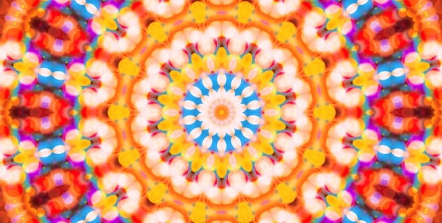 colorful defocused bokeh festive lights in kaleidoscope as abstract holiday celebration background