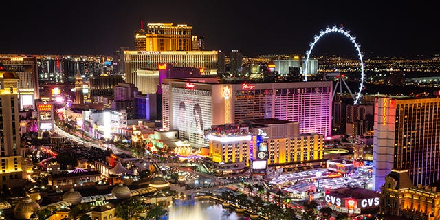 Las Vegas, Nevada skyline at night, with Bellagio Fountains and Linq High Roller