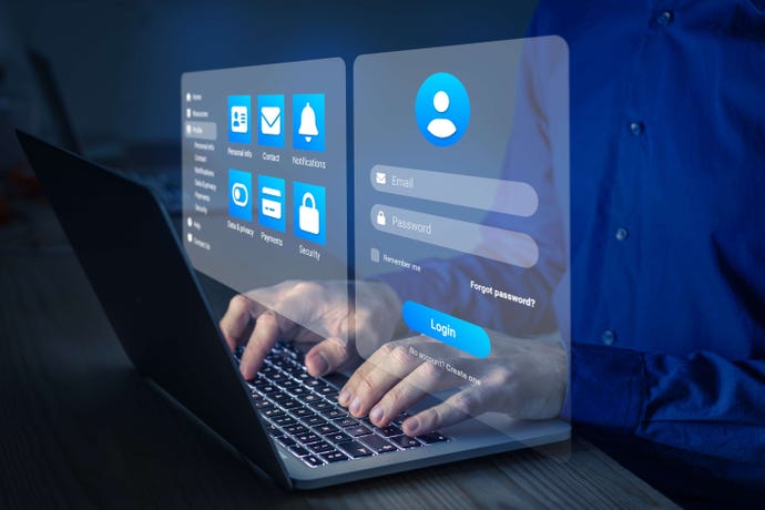 Image shows someone typing at a laptop keyboard with the reflection of a credential login screen