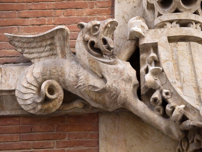 stone carving architectural detail of a wyvern in Madrid, Spain
