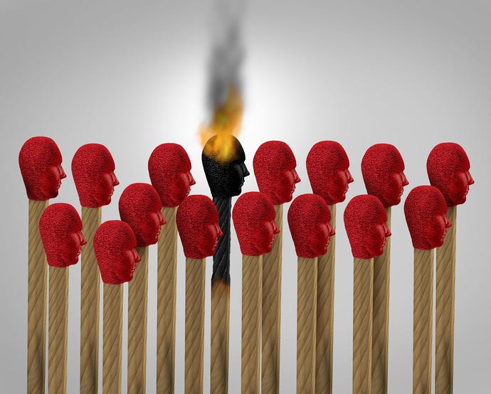 Faces on matchheads indicating burnout