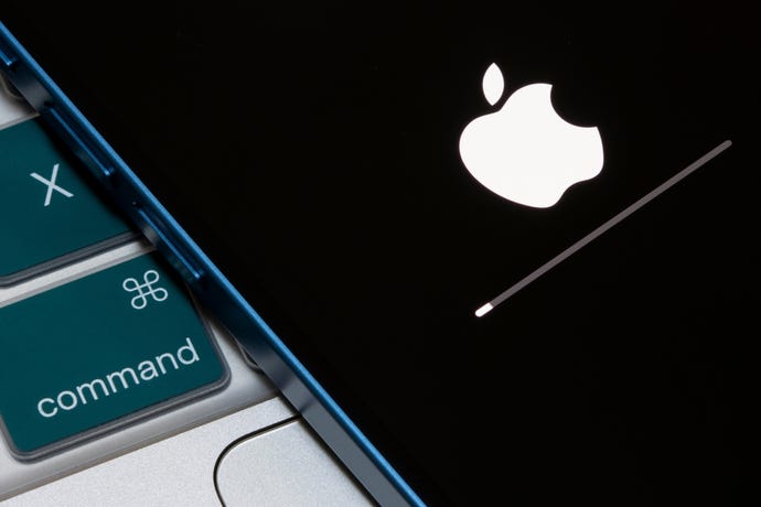 Closeup up of the Apple logo and progress bar seen on an iPhone when the iOS firmware is being updated