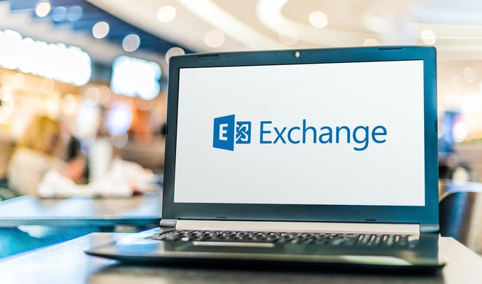 laptop open with microsoft exchange logo displayed on screen