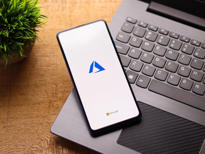 smartphone with microsoft azure logo on top of laptop