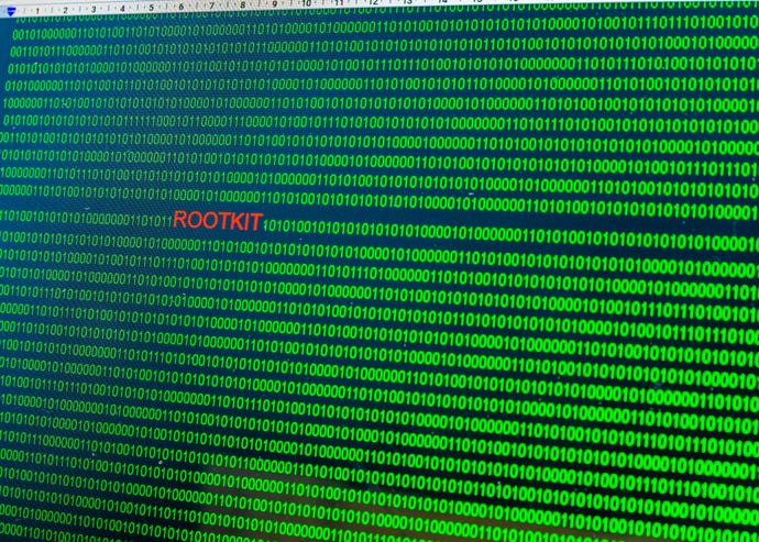 red inscription Rootkit incomputer code