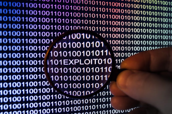 maginfying glass over computer code revealing the word "exploit"