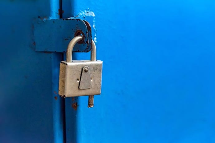 steel lock on a blue door