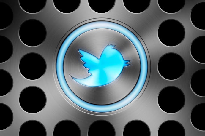 Twitter bird logo on a metallic background