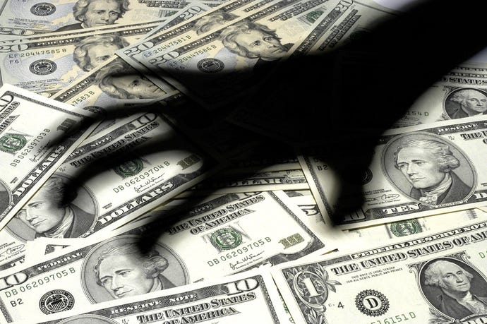 Illustration of a shadowy hand reaching to grab from a pile of American money