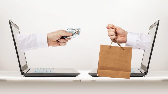 eCommerce concept image with hands coming out of laptops to exchange cash and goods 