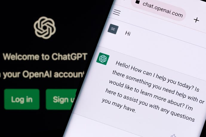 ChatGPT chat bot screen seen on smartphone and laptop display with Chat GPT login screen in the background.