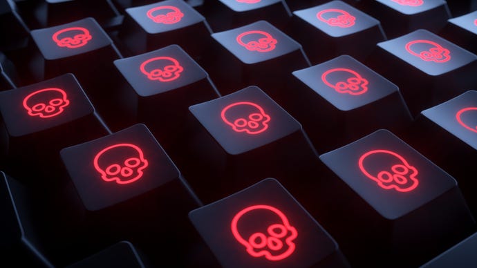 Black computer keyboard with red skulls and crossbones on each key