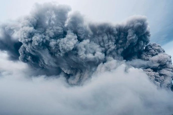 gray billows of smoke during volcanic eruption