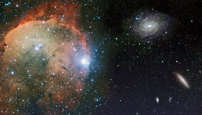 Cosmic landscape with nebula, stardust, spiral galaxy and bright shining stars