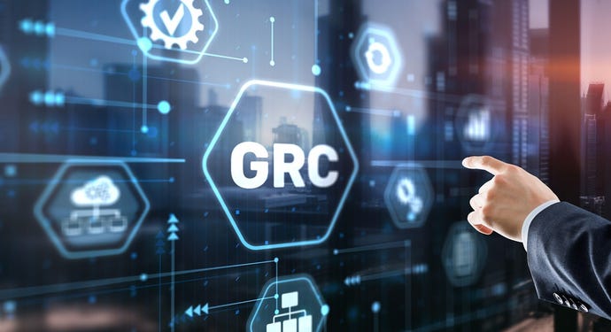 Hand touching "GRC" on a screen