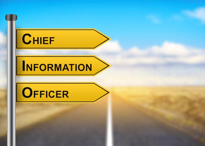 signs saying chief information officer in front of an open road with a blue sky in the background
