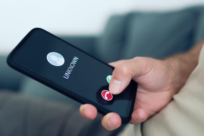 User rejecting a mobile phone call from unknown caller to represent mobile phishing campaign