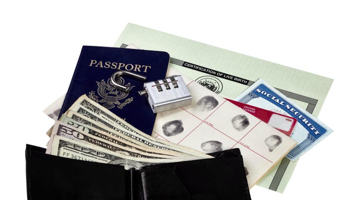 Photo of documents including passport, Social Security card, and fingerprint card lie next to wallet, underneath lock