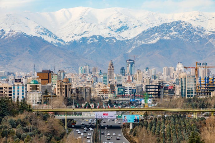 Tehran's city center against snowcapped mountains