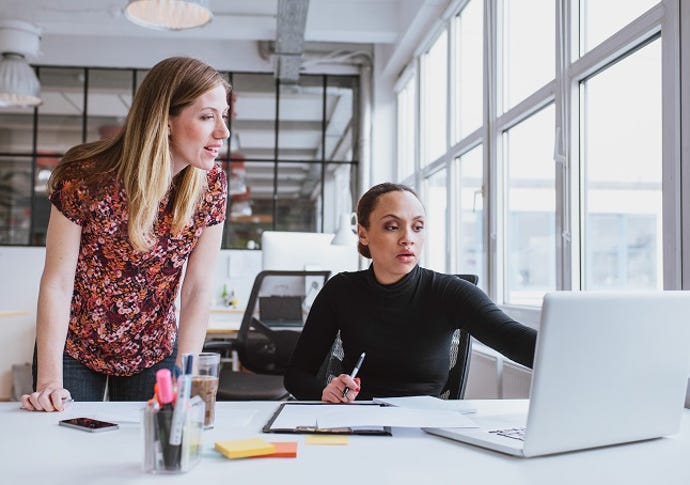 Female technology executives working together on new project.