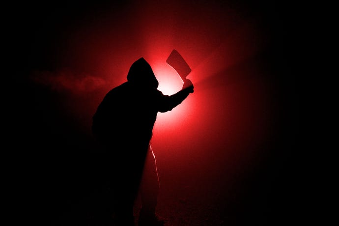 Dark, foggy outdoor silhouette of a man wielding a large cleaver. Duotone red.