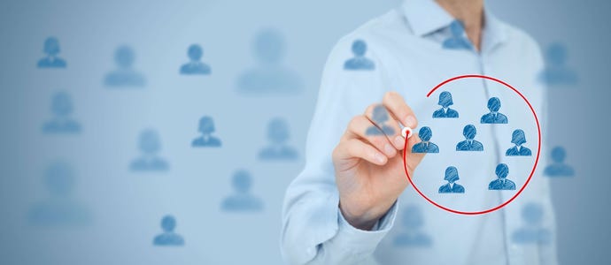 Businessman circling a small group of generic people profiles among a wide grouping of profile pictures