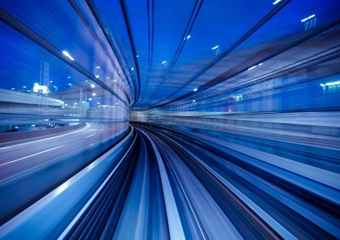 A blue subway railing track blurred out to simulate warp speed movement.