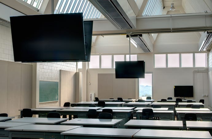 Modern school classroom with flat-screen TVs