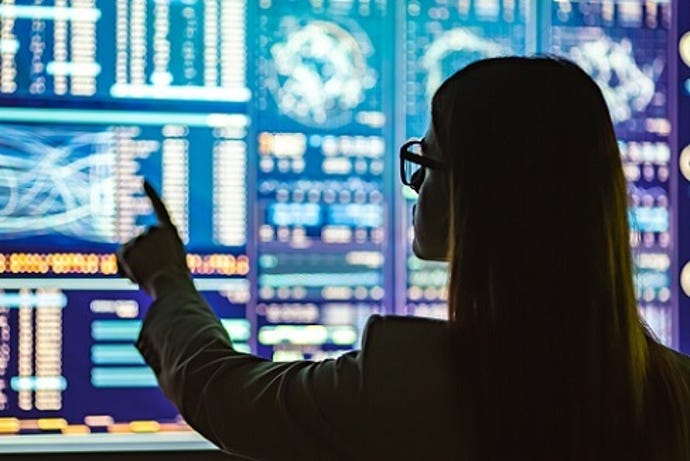 female data scientist pointing to data 