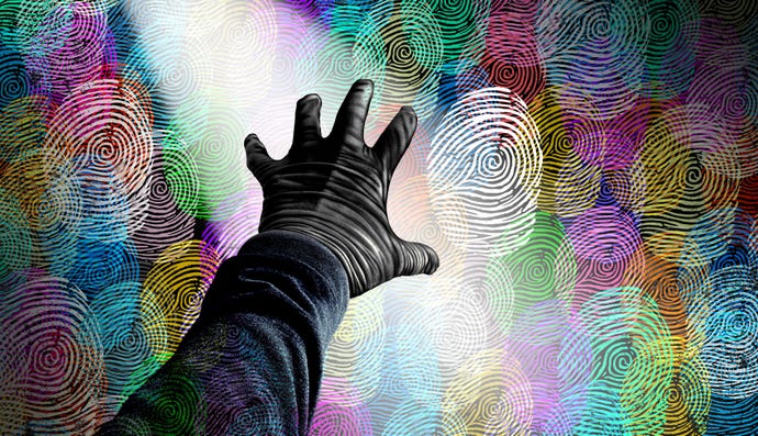 abstract with a hand reaching for computer code