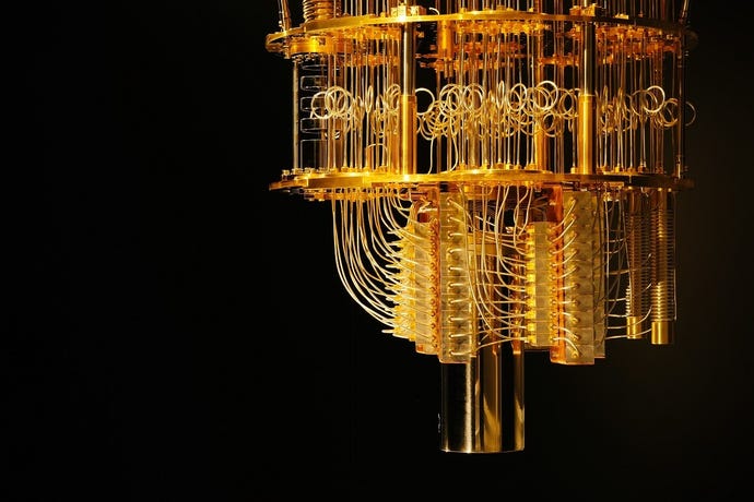 An off-center photo of a quantum computer from IBM. It looks like a steampunk robot chandelier, all shiny wires and loops