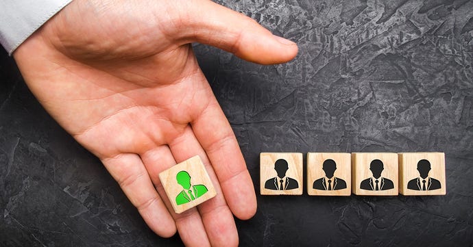 Hand holding symbol for a person in green